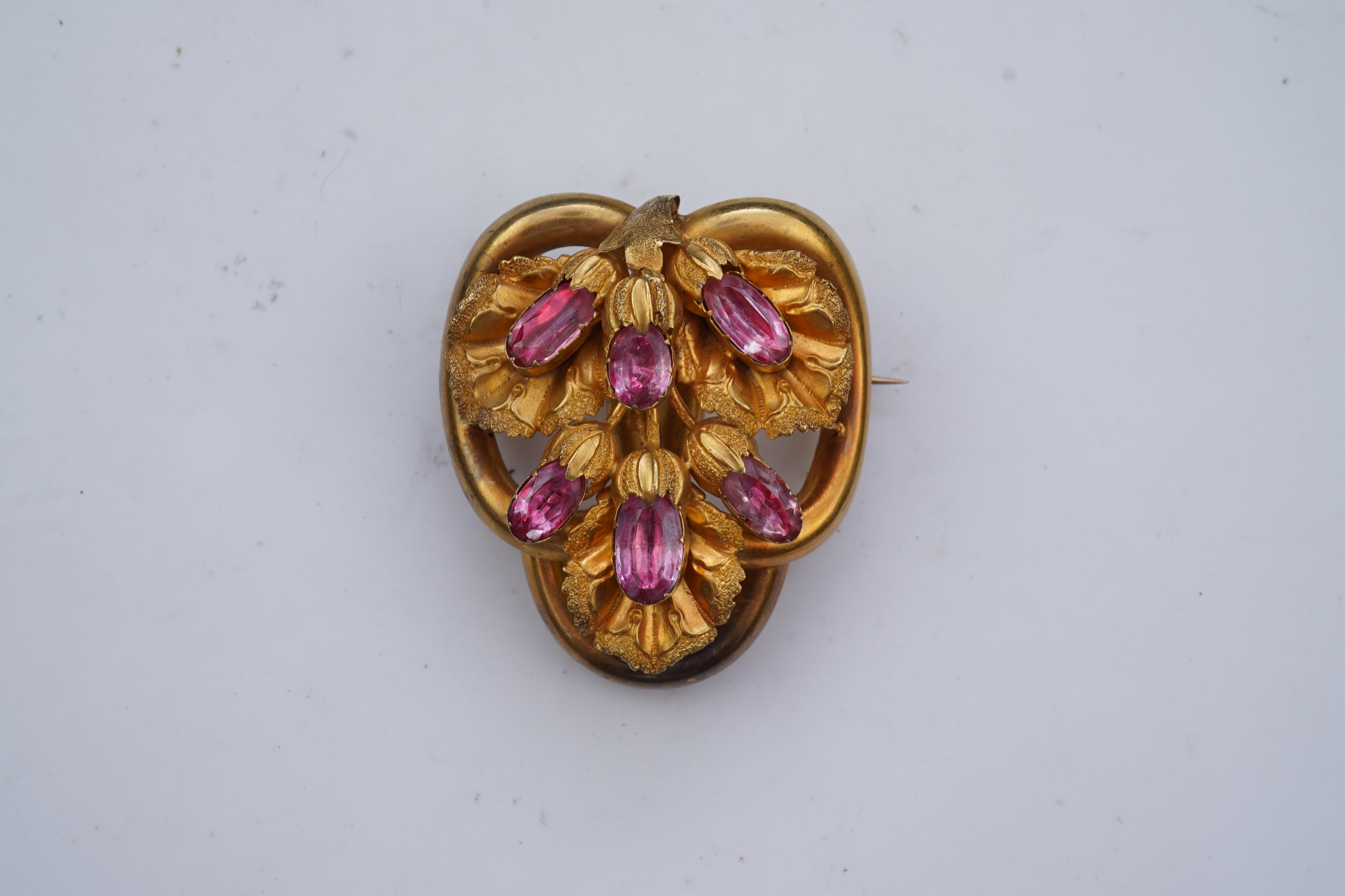 A gold and pink topaz brooch, mid 19th century